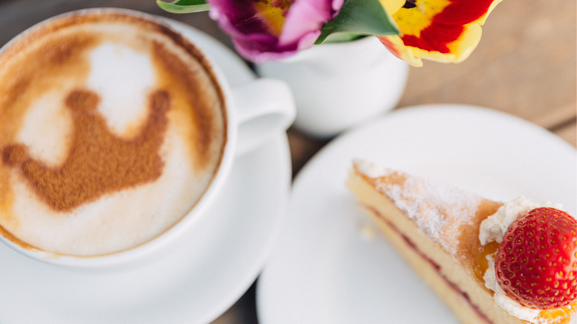 photo of coffee with chocolate crown on and slice of victoria sponge cake in jersey pearl