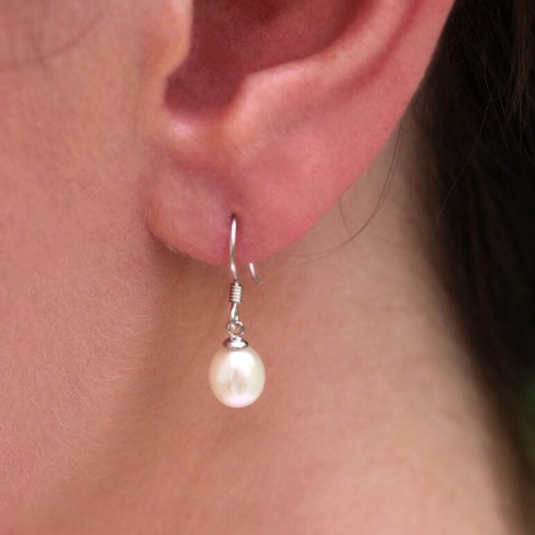 Model Wearing Jersey Pearl Classic Freshwater White Pearl Sterling Silver Hook Earrings