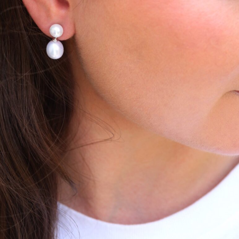 Model wearing Dew Drop Earrings White Freshwter Pearls on Sterling Silver