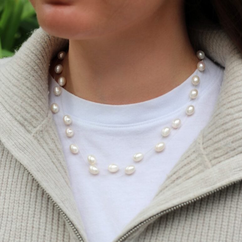 Model wearing Dew Drop Necklace White Freshwater Pearls on Nylon