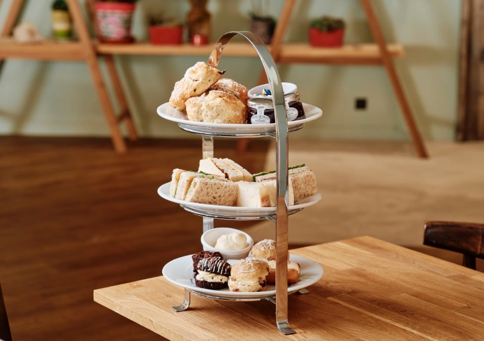 Jersey pearl afternoon tea stand with cakes and sandwiches