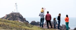 photo of a family walking in St Ouen near to Jersey Pearl