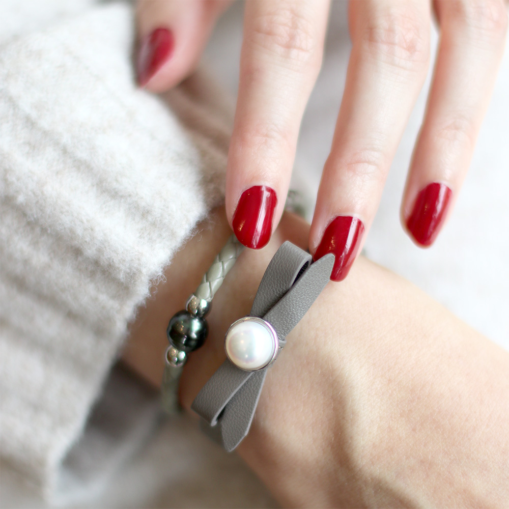 Joli and Tahitian pearl bracelet stacked on models arm