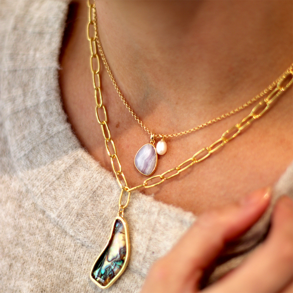 paua and sorel pearl necklaces layered together on model