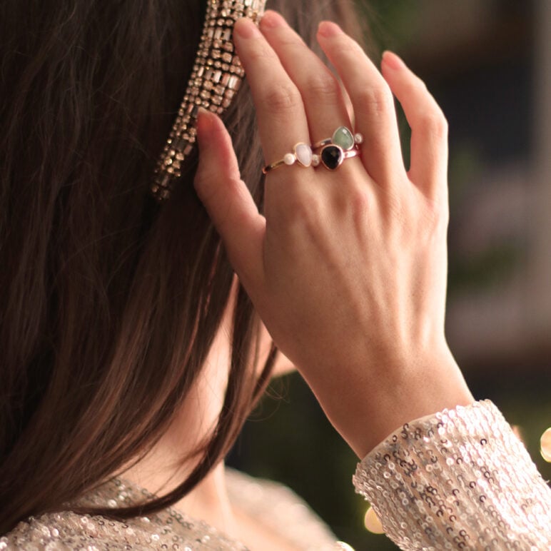 model wearing sparkly Christmas clothes and jersey pearl sorel rings